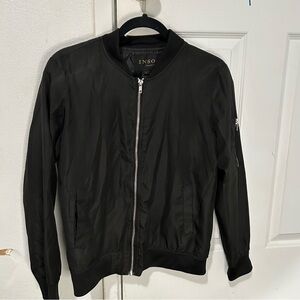 Black zip up sweater.